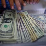 Dollar drifts near two-week low ahead of US inflation data