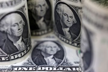 Dollar hits 150 yen then dips on intervention jitters