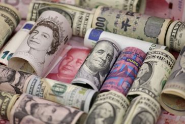 Dollar holds just below 150 yen ahead of busy central bank, data-packed week