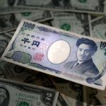 Yen tumbles after BOJ sticks with ultra-loose policy