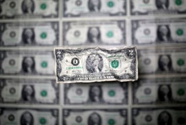 Dollar clings to previous day's gains as focus turns to U.S. data