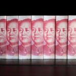 China's yuan eases against the dollar on widening yield differential