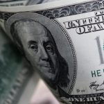 Dollar at one-month peak on easing rate-cut bets; pound jumps after inflation