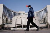 China central bank leaves key policy rate unchanged under shadow of Federal Reserve