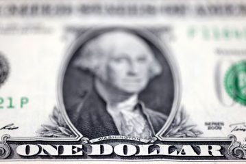 Dollar dips ahead of PMI data releases from major economies