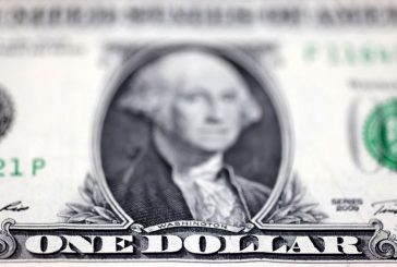 Dollar dips ahead of PMI data releases from major economies