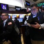 Futures tick up after Wall Street hits record highs