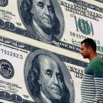 Dollar stabilizes near recent highs; sterling gains on strong PMI data