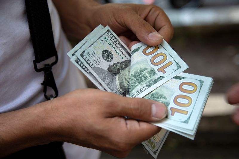 Dollar gains ahead of Fed meeting; yen hands back some gains