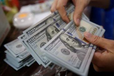 Dollar slips ahead of GDP data; euro rises and yen surges