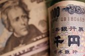 Yen weakens, paring sharp rise after suspected intervention