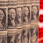 Dollar holds firm as traders trim US rate cut bets