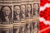 Dollar holds firm as traders trim US rate cut bets