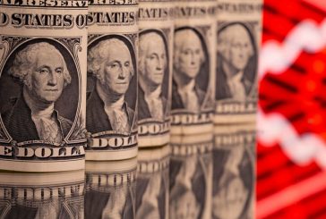 Dollar holds firm as traders trim US rate cut bets