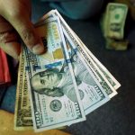 Dollar edges down ahead of data, set for first monthly drop in 2024