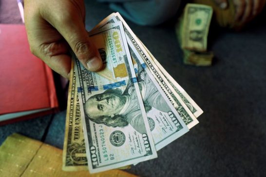 Dollar edges down ahead of data, set for first monthly drop in 2024