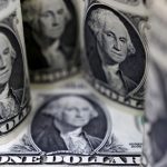 Dollar trades around two-week high as U.S. bond yields surge