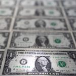 Dollar pares losses as Fed officials project only one rate cut this year