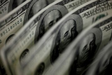 Dollar holds firm as Fed seen less dovish than peers