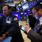 Wall Street ends lower as investors digest inflation data, presidential debate