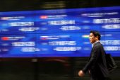 Stocks extend record run, pound steady as UK votes