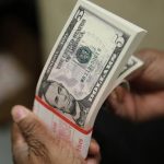 Dollar slips lower on rate cut expectations; euro nears  this year's high