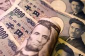 Dollar steady on US jobs relief, yen heads for first weekly drop in six