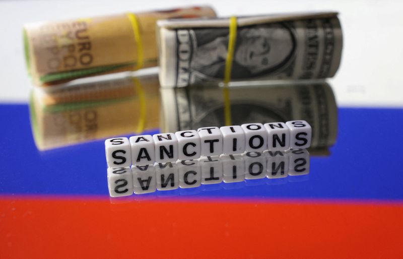 © Reuters. FILE PHOTO: Euro and Dollar banknotes and words 