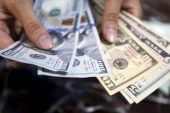 Dollar retains strength ahead of CPI release; sterling weakens again