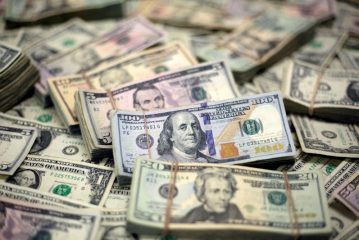 Dollar gives up a bit of post-election surge; central bank decisions awaited