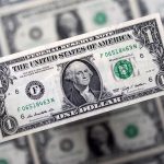 Dollar holds firm at one-year high on Trump trade momentum