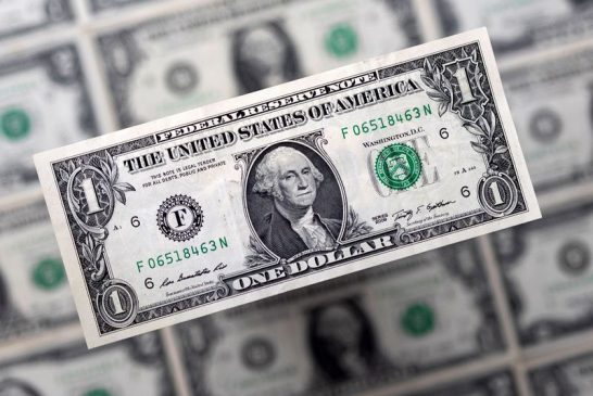 Dollar holds firm at one-year high on Trump trade momentum