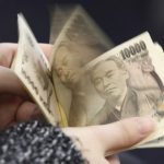 Japanese yen slides past key 155 level after BOJ holds rates steady