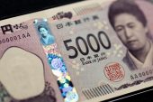 Yen gains on BOJ hike, dollar slides as Trump softens tone on China